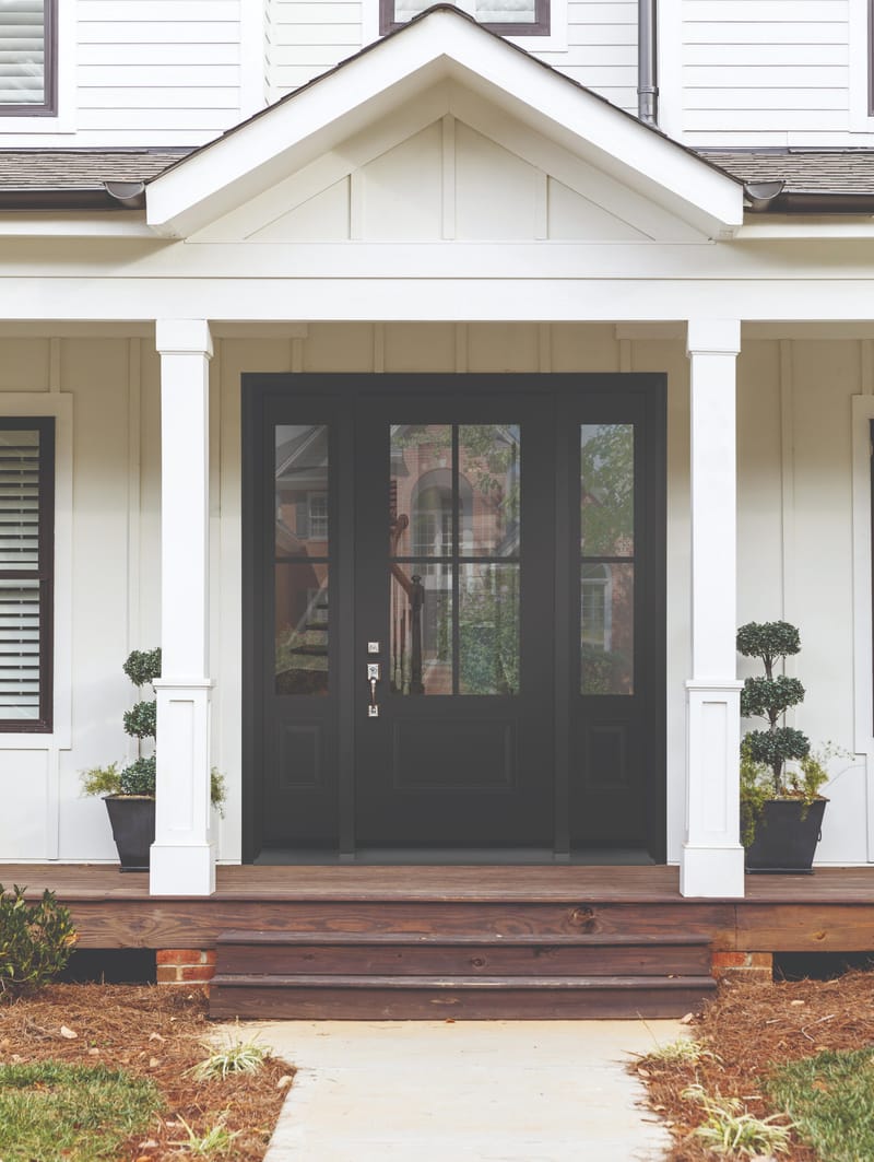 An entry door with two tone internal grills